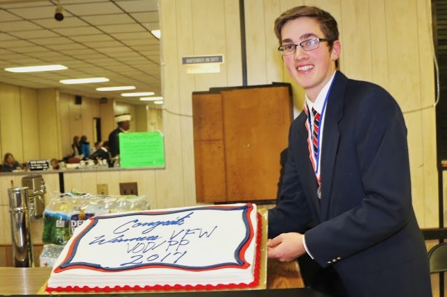This year's Voice of Democracy Contest with a cake celebrating his win.